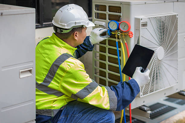 Professional Heat Pump Repair technician working in Trafalgar, IN